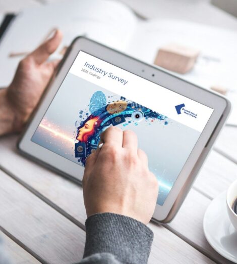Man viewing Biometrics Institute Industry survey on a tablet
